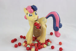 Size: 1280x854 | Tagged: safe, artist:azgchip, imported from derpibooru, bon bon, sweetie drops, earth pony, pony, apple, bag, craft, disgusted, female, food, i didn't put those in my bag, mare, meme, photo, saddle bag, sculpture, standing, upset, wax