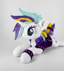 Size: 1024x1132 | Tagged: safe, artist:gingerale2016, imported from derpibooru, rarity, pony, alternate hairstyle, clothes, deviantart watermark, irl, jacket, lying down, obtrusive watermark, photo, plushie, prone, punk, raripunk, solo, watermark