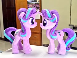 Size: 1024x768 | Tagged: safe, artist:nekokevin, imported from derpibooru, imported from ponybooru, starlight glimmer, pony, unicorn, series:nekokevin's glimmy, duality, duo, female, irl, looking at each other, mare, photo, plushie, self ponidox, similo duplexis, size difference, smiling, table