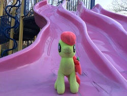 Size: 3264x2448 | Tagged: safe, artist:topsangtheman, imported from derpibooru, peachy sweet, earth pony, pony, apple family member, high res, irl, looking at you, photo, playground, plushie, slide, solo