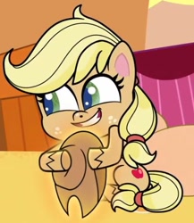 Size: 446x514 | Tagged: safe, imported from derpibooru, screencap, applejack, earth pony, pony, my little pony: pony life, spoiler:pony life s02e10, applejack's hat, cowboy hat, cropped, cute, female, g4.5, hat, hatless, hug, jackabetes, missing accessory, pony life, sitting, solo, teeth, the great cowgirl hat robbery