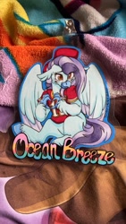 Size: 675x1200 | Tagged: safe, artist:twisted-sketch, imported from derpibooru, oc, oc:ocean breeze, hippogriff, badge, blanket, blushing, claws, clothes, football, hat, hippogriff oc, irl, jersey, kansas city chiefs, photo, sports, traditional art, wings