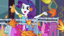 Size: 1000x563 | Tagged: safe, imported from derpibooru, screencap, rarity, equestria girls, equestria girls series, street chic, spoiler:eqg series (season 2), autumn leaves, bracelet, building, clothes, clothes rack, cold weather, cute, geode of shielding, jewelry, leaf, leaves, looking at you, magical geodes, makeup, open mouth, raribetes, rarity peplum dress, smiling, smiling at you, talking, talking to viewer, wind, wind blowing, window
