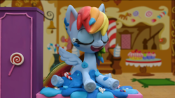 Size: 1920x1080 | Tagged: safe, imported from derpibooru, screencap, rainbow dash, pony, my little pony: pony life, my little pony: stop motion short, cake, food, g4.5, laughing, pony life, solo, stop motion