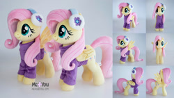 Size: 2500x1406 | Tagged: safe, artist:meplushyou, imported from derpibooru, fluttershy, pegasus, pony, clothes, cute, earmuffs, female, folded wings, irl, mare, photo, plushie, shyabetes, signature, smiling, solo, spread wings, sweater, wings