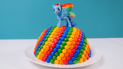 Size: 1920x1080 | Tagged: safe, rainbow dash, pegasus, pony, cake, chocolate, food, irl, m&m's, photo, solo, toy