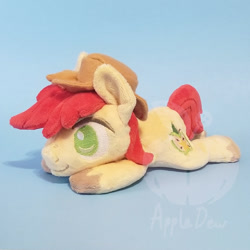 Size: 1000x1000 | Tagged: safe, artist:appledew, imported from derpibooru, bright mac, earth pony, pony, beanie (plushie), chibi, happy, hat, irl, male, photo, plushie, prone, smiling, solo, stallion, unshorn fetlocks