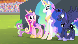 Size: 1920x1080 | Tagged: safe, imported from derpibooru, screencap, princess cadance, princess celestia, princess luna, spike, alicorn, dragon, pony, equestria games (episode), crown, crystal stadium, female, happy, height difference, jewelry, male, mare, open mouth, regalia, spread wings, text, wings