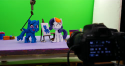 Size: 6408x3388 | Tagged: safe, artist:inspiranimation, imported from derpibooru, rainbow dash, rarity, pegasus, pony, unicorn, my little pony: pony life, my little pony: stop motion short, rarity's paintful pony portrait, absurd resolution, behind the scenes, camera, clay, covered in paint, duo, duo female, female, g4.5, green screen, irl, mare, paint, paint on fur, photo, pony life