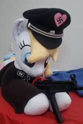 Size: 1960x2941 | Tagged: safe, artist:qtpony, photographer:ryperiour2, oc, oc:aryanne, earth pony, pony, unicorn, armband, clothes, hat, image, irl, life size, mp5, nazi, nazi armband, nazipone, needs more jpeg, photo, plushie, smiley face, socks, swastika