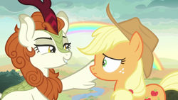 Size: 1920x1080 | Tagged: safe, imported from derpibooru, screencap, applejack, autumn blaze, earth pony, kirin, pony, season 8, sounds of silence, spoiler:s08, applejack's hat, cowboy hat, duo, duo female, female, frown, grin, hat, lidded eyes, lip bite, looking at each other, mare, rainbow, smiling