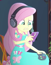 Size: 356x458 | Tagged: safe, imported from derpibooru, screencap, fluttershy, costume conundrum, equestria girls, equestria girls series, spoiler:eqg series (season 2), cellphone, controller, cropped, headphones, headset, phone, solo