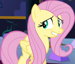 Size: 867x737 | Tagged: safe, imported from derpibooru, screencap, fluttershy, pegasus, pony, party pooped, season 5, cropped, female, grin, mare, nervous, nervous grin, smiling