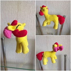 Size: 1448x1448 | Tagged: safe, artist:woodiewool, imported from derpibooru, apple bloom, earth pony, pony, amigurumi, crochet, eyes closed, female, filly, glass table, handmade, irl, photo, plushie, smiling, solo