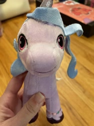 Size: 3024x4032 | Tagged: safe, imported from derpibooru, photographer:errant_harpy, izzy moonbow, pony, unicorn, female, g5, irl, looking at you, mare, my little pony: a new generation, photo, plushie, toy