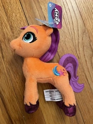 Size: 3024x4032 | Tagged: safe, imported from derpibooru, photographer:errant_harpy, sunny starscout, earth pony, pony, female, g5, irl, mare, my little pony logo, my little pony: a new generation, photo, plushie, toy