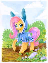 Size: 949x1233 | Tagged: safe, artist:maytee, imported from derpibooru, fluttershy, pegasus, pony, animal costume, bunny costume, bunny ears, bush, clothes, cloud, costume, cute, daaaaaaaaaaaw, dangerous mission outfit, female, flower, goggles, hood, hoodie, looking at you, mare, marker drawing, raised hoof, shyabetes, smiling, solo, traditional art, weapons-grade cute