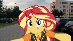 Size: 1920x1080 | Tagged: safe, imported from derpibooru, sunset shimmer, equestria girls, car, dusk, irl, looking at you, photo, smiling, solo, tongue out