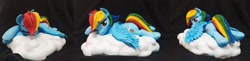 Size: 2277x552 | Tagged: safe, artist:vita96, imported from derpibooru, rainbow dash, pegasus, pony, cloud, craft, female, frog (hoof), irl, looking at you, lying down, mare, on a cloud, one eye closed, photo, polymer clay, prone, sculpture, solo, underhoof