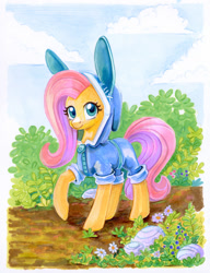 Size: 949x1233 | Tagged: safe, artist:maytee, imported from derpibooru, fluttershy, pegasus, pony, bunny ears, bush, clothes, costume, cute, daaaaaaaaaaaw, female, flower, hood, hoodie, mare, shyabetes, solo, traditional art