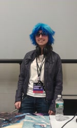 Size: 1952x3264 | Tagged: safe, artist:nowacking, imported from derpibooru, dj pon-3, vinyl scratch, human, bronycon, bronycon 2012, 2012, clothes, cosplay, costume, headphones, irl, irl human, jesse nowack, photo, sunglasses, water bottle