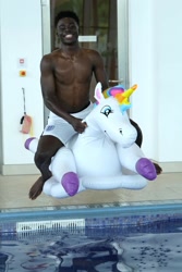 Size: 1365x2048 | Tagged: safe, imported from ponybooru, human, unicorn, england, euro 2020, inflatable toy, irl, irl human, photo, some black guy