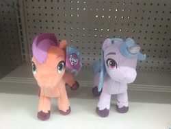 Size: 4160x3120 | Tagged: safe, imported from ponybooru, izzy moonbow, earth pony, unicorn, duo, female, g5, looking at you, my little pony logo, my little pony: a new generation, photo, plushie, toy, walmart