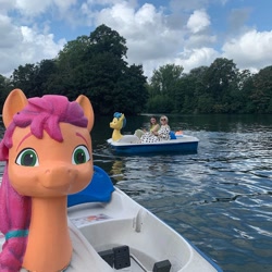 Size: 1080x1080 | Tagged: safe, imported from derpibooru, hitch trailblazer, sunny starscout, earth pony, human, pony, boat, bust, female, g5, irl, irl human, lake, london, lottie.london, male, mare, official, photo, stallion, tree