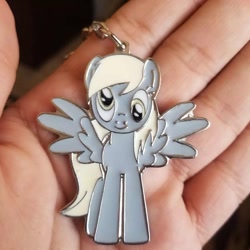 Size: 1080x1080 | Tagged: safe, imported from derpibooru, derpy hooves, human, pegasus, pony, hand, irl, irl human, irl photo, keychain, photo, spread wings, wings