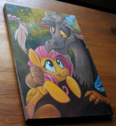 Size: 659x716 | Tagged: safe, artist:kenket, artist:spainfischer, imported from derpibooru, discord, fluttershy, draconequus, pegasus, pony, acrylic painting, female, handmade, hug, hugging a pony, irl, irl photo, looking at each other, male, mare, painting, scenery, selling, smiling, smiling at each other, snuggling, traditional art, wood