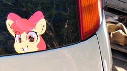 Size: 3120x1755 | Tagged: safe, artist:partylikeanartist, imported from derpibooru, apple bloom, earth pony, pony, car, female, filly, grin, irl, looking back, peeking, photo, smiling, sticker