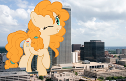 Size: 1726x1112 | Tagged: safe, artist:jhayarr23, artist:thegiantponyfan, imported from derpibooru, pear butter, earth pony, pony, female, freckles, giant pony, giant/macro earth pony, giantess, highrise ponies, irl, macro, mare, mega giant, oklahoma, oklahoma city, one eye closed, photo, ponies in real life, raised hoof, smiling, wink