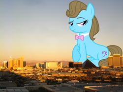 Size: 3200x2400 | Tagged: safe, artist:the smiling pony, artist:thegiantponyfan, imported from derpibooru, beauty brass, earth pony, pony, female, giant pony, giant/macro earth pony, giantess, high res, highrise ponies, irl, las vegas, lidded eyes, macro, mare, mega giant, nevada, photo, ponies in real life, sitting, smiling