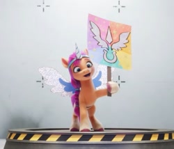 Size: 612x524 | Tagged: safe, imported from derpibooru, screencap, sunny starscout, earth pony, pony, spoiler:my little pony: a new generation, 3d, alicorn costume, costume, cute, fake horn, fake wings, female, g5, mare, my little pony: a new generation, sign, sunnybetes