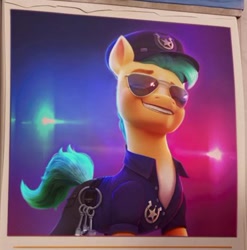 Size: 375x379 | Tagged: safe, imported from derpibooru, screencap, hitch trailblazer, earth pony, pony, spoiler:my little pony: a new generation, calendar, clothes, g5, grin, hat, key, male, markings, my little pony: a new generation, pants, police, police hat, police officer, police uniform, shirt, smiling, solo, stallion, stupid sexy hitch trailblazer, sunglasses