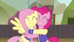 Size: 1280x720 | Tagged: safe, imported from derpibooru, screencap, fluttershy, pinkie pie, earth pony, pegasus, pony, buckball season, season 6, bipedal, cute, diapinkes, duo, duo female, eyes closed, female, grin, hug, implied flutterpie, mare, shipping fuel, shyabetes, smiling