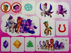 Size: 1858x1397 | Tagged: safe, imported from derpibooru, hitch trailblazer, izzy moonbow, pipp petals, sunny starscout, zipp storm, earth pony, pegasus, pony, unicorn, 3d, book, button, crystal, dreamworks face, egmont, flying, g5, hug, male, mane five (g5), merchandise, my little pony: a new generation, official, photo, proud, red eyes, smiling, stallion, sticker