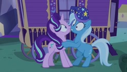 Size: 640x360 | Tagged: safe, imported from derpibooru, screencap, starlight glimmer, trixie, pony, unicorn, to where and back again, female, hat, mare, night, nightcap, nose to nose, trixie's nightcap, trixie's wagon, wagon