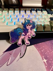 Size: 3024x4032 | Tagged: safe, artist:redpalette, imported from derpibooru, izzy moonbow, pony, unicorn, cute, etsy, g5, happy, hind legs, irl, keyboard, merchandise, my little pony: a new generation, photo, rgb, smiling, sparkle, sparkles, sticker