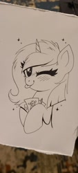 Size: 922x2048 | Tagged: safe, artist:confetticakez, oc, oc only, pony, unicorn, blushing, monochrome, paper, pencil, simple background, tongue out, winking at you