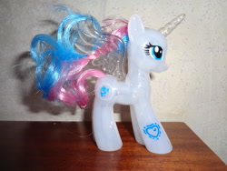 Size: 2592x1944 | Tagged: safe, imported from derpibooru, princess celestia, princess luna, alicorn, pony, brushable, eyeshadow, fusion, horn, irl, irl toy, makeup, photo, solo, spread wings, toy, transparent horn, transparent wings, wings