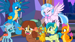 Size: 1600x900 | Tagged: safe, imported from derpibooru, screencap, gallus, ocellus, sandbar, silverstream, smolder, yona, changedling, changeling, classical hippogriff, dragon, earth pony, griffon, hippogriff, pony, yak, she's all yak, bow, bowtie, cloven hooves, dragoness, eyes closed, female, hair bow, hand on hip, jewelry, male, monkey swings, necklace, spread wings, student six, wings