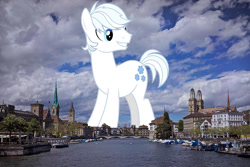 Size: 1500x1000 | Tagged: safe, artist:jaredking779, artist:masem, imported from derpibooru, double diamond, earth pony, pony, giant pony, giant/macro earth pony, highrise ponies, irl, looking back, macro, male, mega giant, photo, ponies in real life, smiling, solo, stallion, switzerland, zurich