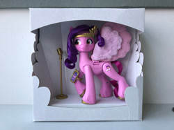 Size: 2500x1875 | Tagged: safe, imported from derpibooru, pipp petals, pegasus, pony, behind the scenes, cardboard box, concave belly, female, g5, irl, mare, my little pony: a new generation, packaging, photo, prototype, raised hoof, red eyes, red-eyed pipp, skinny pipp, slim, solo, thin, toy