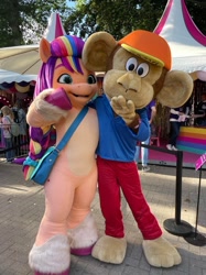 Size: 1124x1500 | Tagged: safe, imported from derpibooru, sunny starscout, anthro, earth pony, human, monkey, pony, bag, fursuit, g5, irl, irl human, mascot, mascot costume, netherlands, official, photo, smiling, tina festival