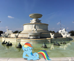 Size: 1482x1222 | Tagged: safe, artist:dashiesparkle, artist:jaredking779, imported from derpibooru, rainbow dash, pegasus, pony, detroit, eyes closed, female, fountain, hoof on cheek, irl, lying down, mare, michigan, photo, ponies in real life, prone, smiling, solo