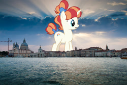 Size: 1024x683 | Tagged: safe, artist:cantercoltz, artist:jaredking779, imported from derpibooru, rainbow stars, pony, unicorn, background pony, bow, female, giant pony, giant unicorn, giantess, hair bow, highrise ponies, irl, italy, macro, mare, mega giant, photo, ponies in real life, tail, tail bow, venice