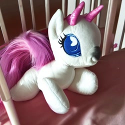 Size: 512x512 | Tagged: safe, imported from derpibooru, bicorn, ai content, ai generated, crib, foal, generator:stable diffusion, horn, multiple horns, photo, plushie, solo