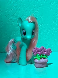 Size: 3024x4032 | Tagged: safe, imported from derpibooru, minty, a very minty christmas, accessory, brushable, figurine, flower, flower pot, g3, hair, photo, picture, simple background, teal background, toy