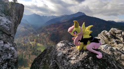 Size: 1192x670 | Tagged: safe, imported from derpibooru, fluttershy, bat pony, pony, bat ponified, female, flutterbat, irl, mountain, photo, plushie, ponies in real life, race swap